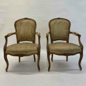 A Pair of Louis XV Cabriolet Armchairs